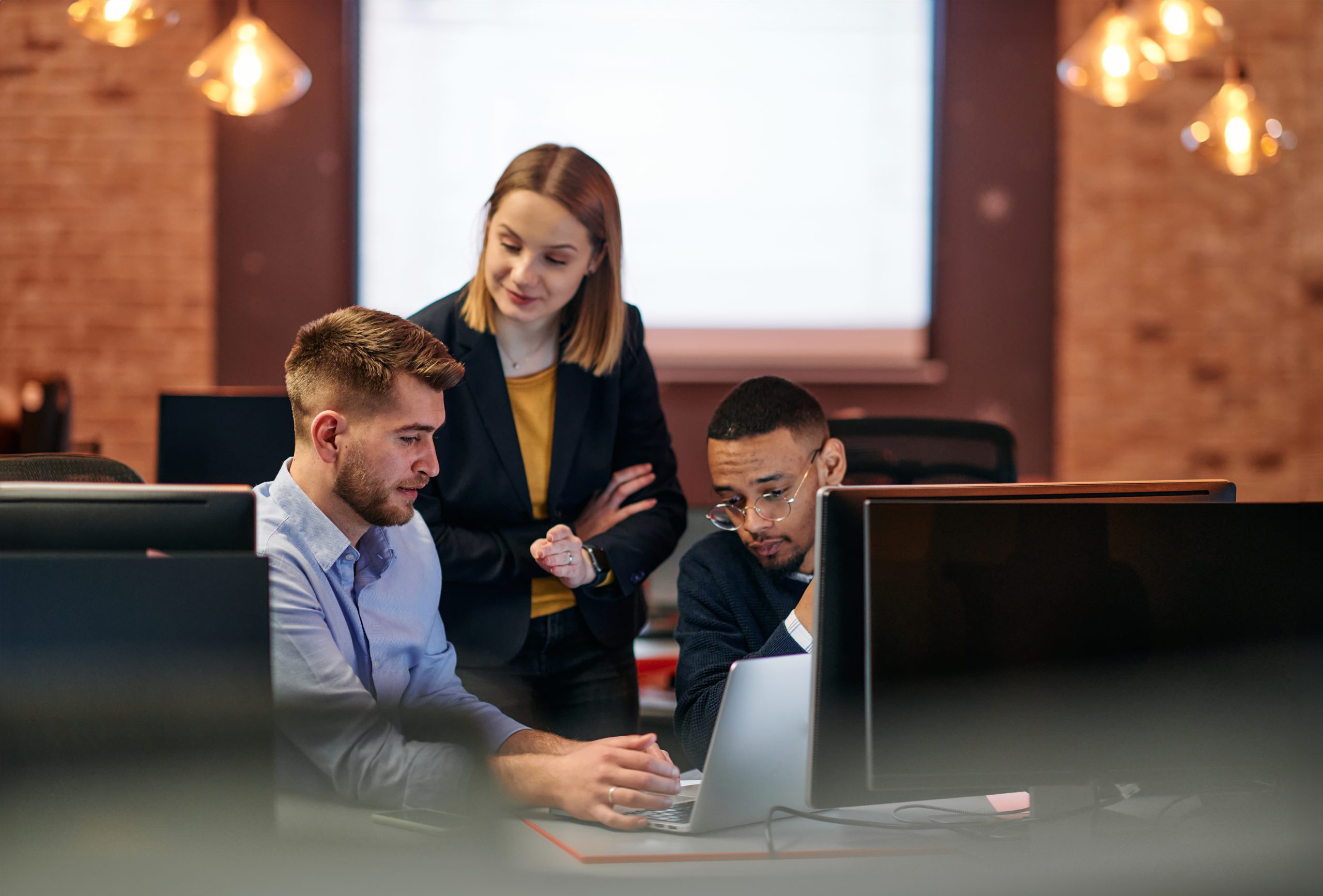 Strategic Business Meeting: Group of Professionals Collaborating in Office Using Computers